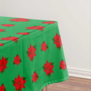 Christmas Poinsettia Flowers on Green Tablecloth