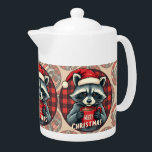 Christmas Raccoon Cocoa Cheer Teapot<br><div class="desc">A charming raccoon dressed in a Santa hat holds a steaming mug of cocoa before a red buffalo plaid backdrop, capturing the cozy spirit of a rustic woodland Christmas. The combination of festive red, soft gray fur, and classic flannel pattern brings warmth and nostalgia to the holiday season. With its...</div>