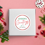 Christmas Round Sticker Red Script Personalized<br><div class="desc">Complete your Christmas gifts and envelopes this year with a personalised Christmas label. This Season's Greetings round sticker includes a modern red and green holiday design with stylish script font and faux red foil effect.</div>