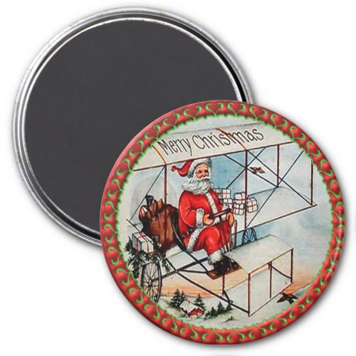 Christmas Santa flying a old airplane Magnet