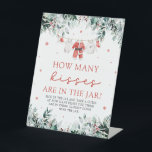 Christmas Santa Guess How Many Kisses Baby Shower  Pedestal Sign<br><div class="desc">The Red Christmas Santa Baby Clothes Guess How Many Kisses Baby Shower Poster is a fun and festive addition to your holiday-themed baby shower. Featuring a charming red backdrop and a cute clothesline of baby clothes, this interactive poster invites guests to guess the number of chocolate kisses in a jar....</div>
