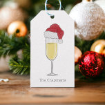 Christmas Santa Hat Champagne Festive Gift Tags<br><div class="desc">The Santa Champagne gift tags are a charming way to add a festive touch to your holiday gift-giving. These tags feature a Santa hat on a champagne glass, making them perfect for pairing with a bottle of bubbly or other holiday gifts. With their cheerful and unique design, these gift tags...</div>
