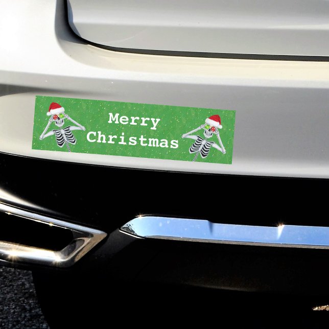 Christmas Skeleton Ornament Eyes Santa Hat Green Car Magnet (Two fun skeletons ornament eyes Santa hats on Merry Christmas Green magnet bumper sticker.)