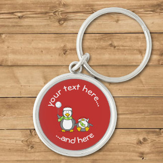 Christmas Snowballing Penguins Keychain