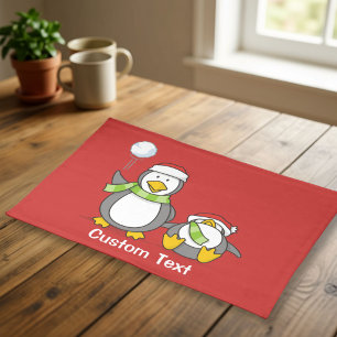 Christmas Snowballing penguins Placemat