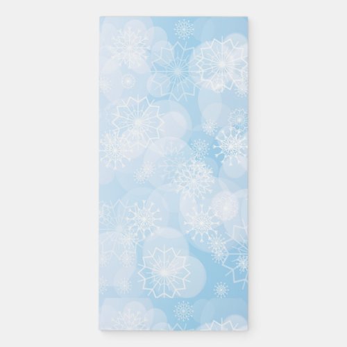 Christmas snowflakes on a blue background         magnetic notepad