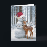 Christmas Snowman Hugging a Fawn Holiday Card<br><div class="desc">A whimsical scene in a snow-covered forest features a friendly snowman with a carrot nose and Santa Claus hat,  with a young deer nuzzling against it.
All inside text can be changed.</div>