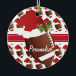 Christmas Sport Football Santa Hat Ceramic Ornament<br><div class="desc">Christmas Football Ornament ready for you to personalize. A great holiday gift for a football player, football fan, football coach or football enthusiast. ⭐This Product is 100% Customizable. Graphics and / or text can be added, deleted, moved, resized, changed around, rotated, etc... 99% of my designs in my store are...</div>