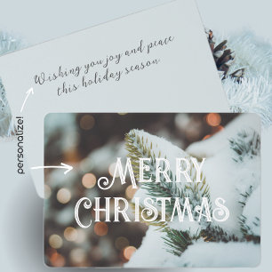 Christmas spruce branch and winter lights card