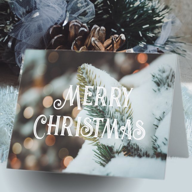 Christmas spruce branch and winter lights holiday card (Creator Uploaded)