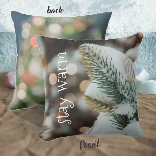 Christmas spruce branch and winter lights throw pillow