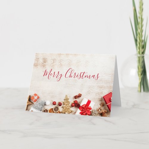 Christmas Themed Items on a Rustic Wooden Board Card