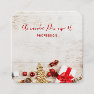Christmas Themed Items on a Rustic Wooden Board Square Business Card