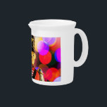 Christmas toy soldier figurine SlipperyJoe gay pri Beverage Pitcher<br><div class="desc">Christmas toy soldier figurine SlipperyJoe gay pride gifts LGBTQIA colorful bokeh lights background vibrant colored red jacket uniform gold buttons shoulder epaulets cartoonish face artistic black hat gold eagle emblem pink purple yellow red festive atmosphere</div>