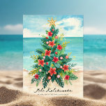 Christmas Tree by the Sea Tropical Holiday Card<br><div class="desc">Bring a splash of island cheer to your holiday season with this "Christmas Tree by the Sea" Christmas card. Featuring a unique tree crafted from palm leaves, adorned with red and pink hibiscus flowers, festive ornaments, and topped with a charming starfish, this design perfectly blends traditional holiday spirit with tropical,...</div>