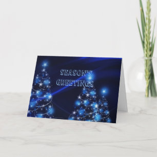 Christmas tree lights on blue holiday card