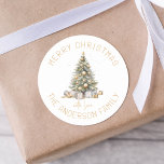 Christmas Tree Personalized Gift And Envelope Classic Round Sticker<br><div class="desc">This holiday season, dress up your gifts and cards with a touch of luxury and style. Our personalized stickers feature a modern Christmas tree adorned with golden baubles and presents, and are personalized with your family name for an extra special festive feel. Add a luxurious touch to your Christmas celebration...</div>