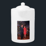 Christmas Tree President John Kennedy & Jacqueline Teapot<br><div class="desc">The year was 1962. President John F. Kennedy and First Lady Jacqueline Kennedy were at the height of their popularity, and the White House was abuzz with excitement as the holiday season approached. The First Lady, known for her impeccable taste and attention to detail, had meticulously planned the White House...</div>