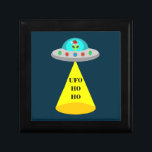 Christmas UFO Ho Ho Alien flying saucer Gift Box<br><div class="desc">This awesome Christmas gift box features a digital art image of an alien spacecraft decorated with bright colored Christmas lights. Inside the UFO looking out through the window there is a green alien with black eyes wearing a festive Santa hat. There is a cone of light coming from the flying...</div>