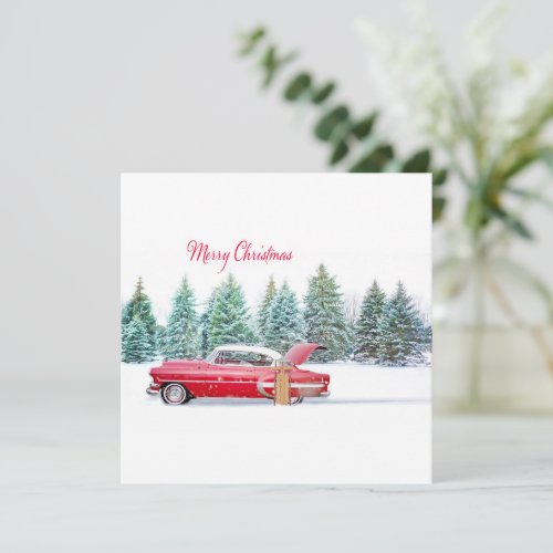 Christmas Vintage red car with snowy landscape
