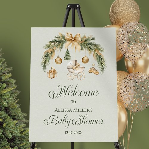 Matching watercolor pine bough and calligraphy winter baby shower welcome sign displayed on an easel