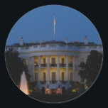Christmas White House at Night in Washington DC Classic Round Sticker<br><div class="desc">This time of year, the White House is decorated for Christmas. In this picture, you can see the pretty wreaths and garlands hung on all the balconies, as well as the lighted trees in front. You can also see a lights from tree in the window. This photo is also featured...</div>