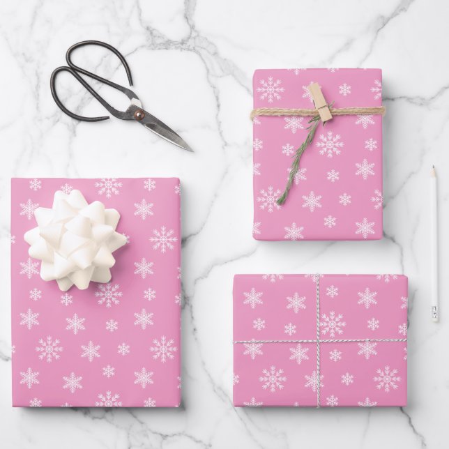 Christmas white snowflakes on pink background wrapping paper sheets (Front)