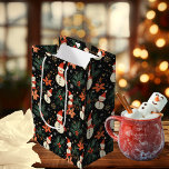 Christmas Winter Holiday Snowman Floral Pattern  Medium Gift Bag<br><div class="desc">Christmas and winter holiday snowman,  poinsettias and pine and berries floral pattern on a black background.</div>