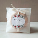 Christmas Wreath | Floral Holiday Wedding Classic  Classic Round Sticker<br><div class="desc">These simple and elegant holiday wedding thank you stickers feature stylish,  watercolor bouquets made up of modern greenery and red and white Christmas flowers on a white background. The words "thank you" appear in trendy calligraphy script.</div>