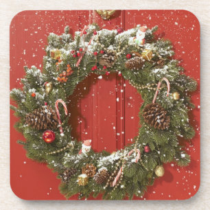 Christmas wreath hanging on a door coaster