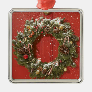 Christmas wreath hanging on a door metal ornament