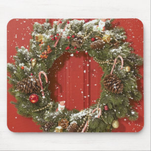 Christmas wreath hanging on a door mouse pad