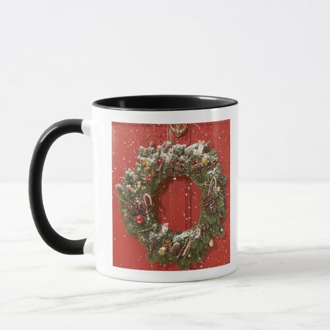 Christmas wreath hanging on a door mug (Left)