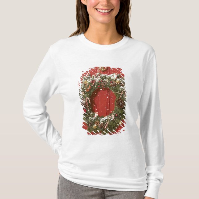 Christmas wreath hanging on a door T-Shirt (Front)