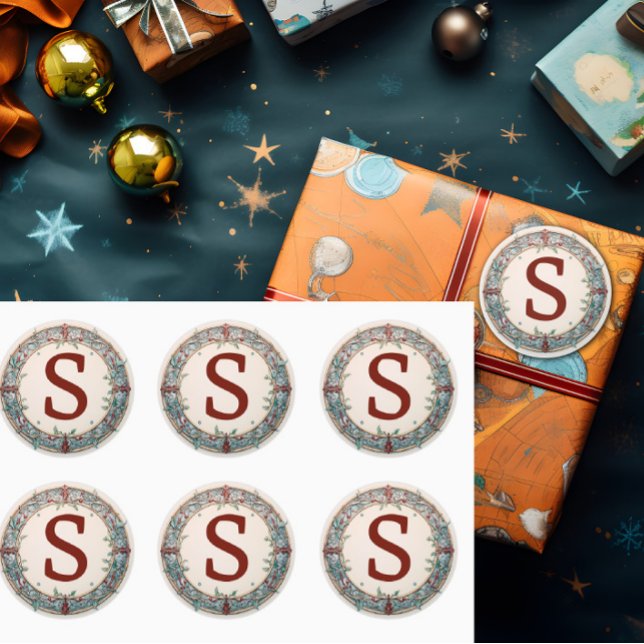 Christmas Wreath Monogram Classic Round Sticker (A single initial is shown on a Christmas wreath monogram sticker label.)