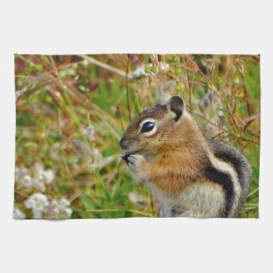 Chubby cute chipmunk on on wood stump towel