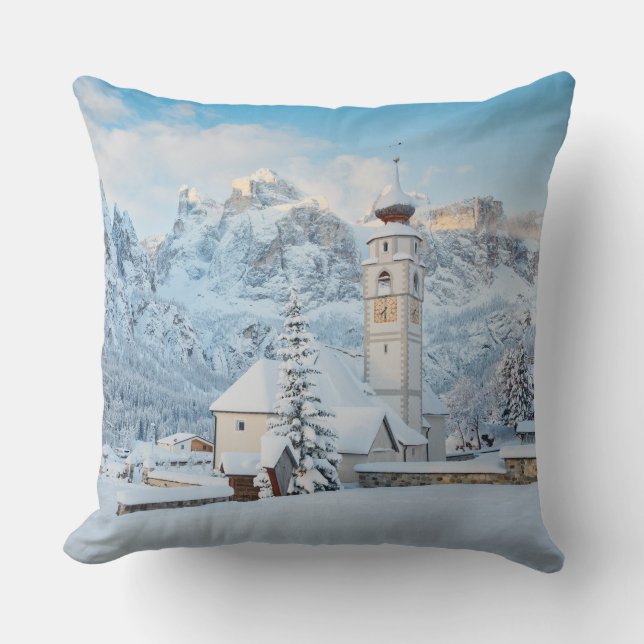 Church covered in snow with mountain background throw pillow (Front)