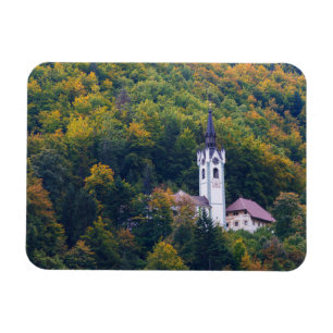 Church in a fall forest in Slovenia Magnet