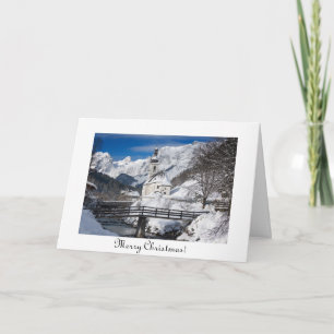 Church in the snow with Alps mountains Christmas Card