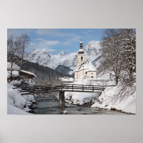 Church in the snow with Alps mountains in winter Poster