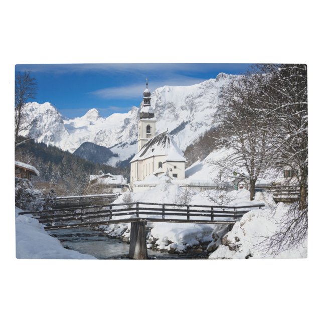 Church in the snow with Alps mountains Metal Print (Front)