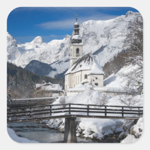 Church in the snow with Alps mountains Square Sticker