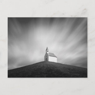 Church on a hill in black and white postcard