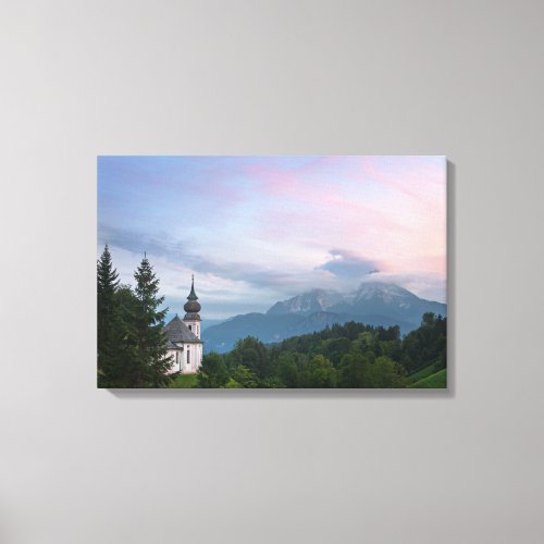 Church with Alps mountains at sunset Canvas Print