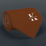Cinnamon Brown Elegant Monogram   Name Neck Tie<br><div class="desc">An elegant necktie featuring a bold white monogram across a rich Cinnamon Brown background. On top of this monogram sits your first or last name spelled out in all capitals. If you prefer a bolder look for the personal name inside of the large letter you can do the following: Use...</div>