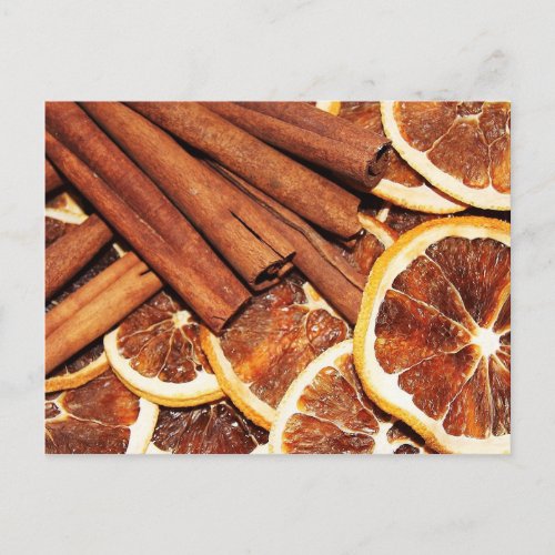 Cinnamon sticks with dried orange slices postcard