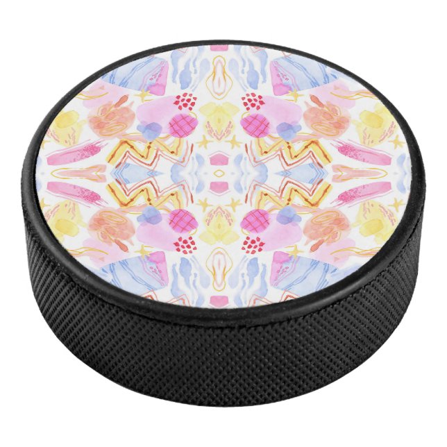 Circular object featuring a colorful abstract  hockey puck (3/4)