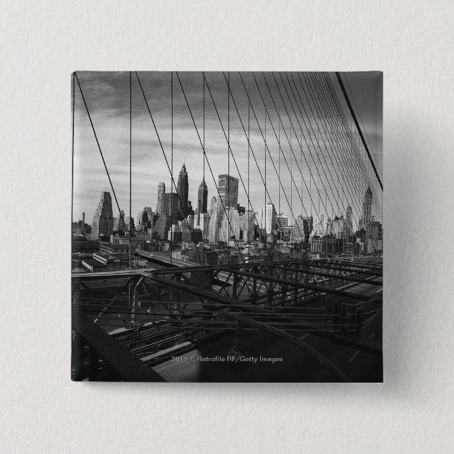 Cityscape through bridge cables button (Front)