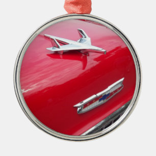 Classic aero style hood ornament with red paint