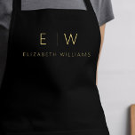 Classic Black Gold Minimalist Monogram Name Apron<br><div class="desc">Elevate your culinary experience with our Classic Elegant Modern Minimalist Monogram Name Cooking Apron. This kitchen essential seamlessly merges timeless elegance with contemporary minimalism. Crafted with precision, this apron is not just a practical accessory but also a statement of personal style. The customizable monogram and name option allows you to...</div>